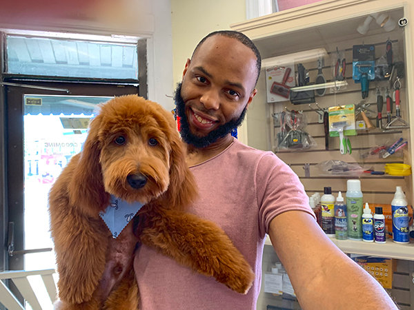 Customer holding dog